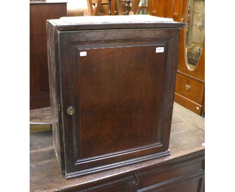 An 18th Century Oak Hanging Cupboard, with moulded door, 56cm by 29cm by 64cm, together with An Oak Thirty Hour Painted Dial 