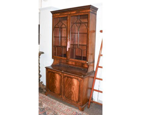 A George III-Style Mahogany Glazed Bookcase, early 20th century, the Greek Key dentil cornice above a plain frieze and astrag