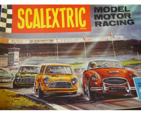 A Vintage Scalextric Motor Racing Track, with three vintage cars, transformer, hand controllers together with a quantity of k