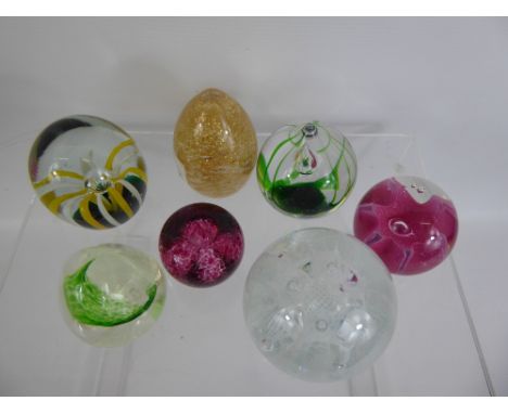 A Quantity of Glass Paperweights, including Caithness 'Congratulations' amongst others.