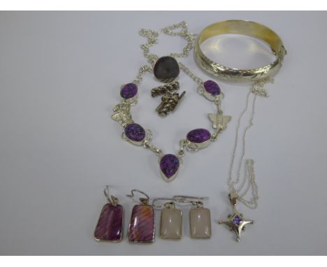 A 925 Bangle, necklace, golf tee, drop earrings, gentleman's rope cuff links and rose quartz drop earrings.