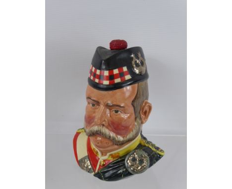 A Royal Doulton 25 Year Old Grant's Scotch Whisky Character Decanter, together with a Moorcroft style vase initials to base, 