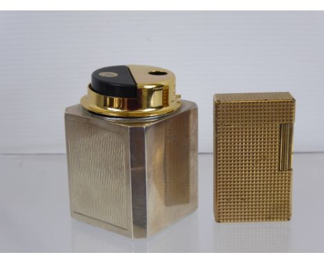A Vintage Silver Cased Desk Lighter, together with a gold plated Dupont lighter.