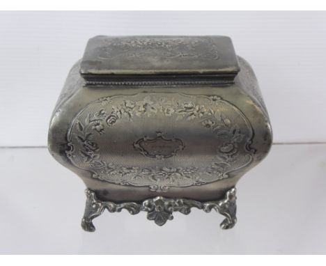 A 19th Century Pewter Tea Caddy, embossed with floral design, dated 1862.