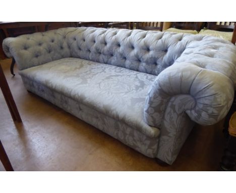 A Regency Button Back Sofa, raised on bun feet, upholstered  in duck egg blue fabric, approx 210 x 95 cms.