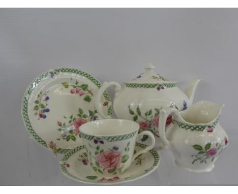 A Royal Doulton 'Victorian Garden' Tea Set, comprising four tea plates, four tea cups, four saucers and milk jug.