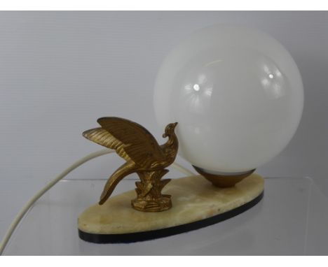 An Art Deco Brass Lamp, depicting an exotic bird on marble base.