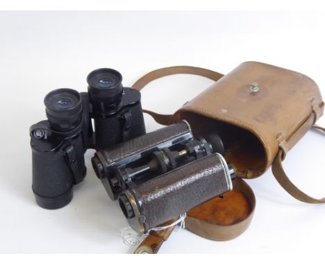 A Pair of Trieder Army Issue Binoculars. in the original case, together with a pair of Boots field binoculars, 8 x 30 uncased