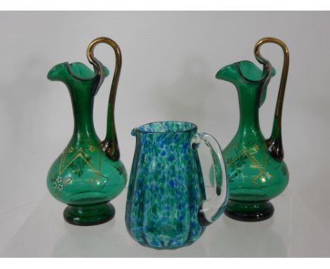 A Pair of Victorian Sea Green Water Decanters, with enamel decoration, together with a  green/blue glass jug. (3)