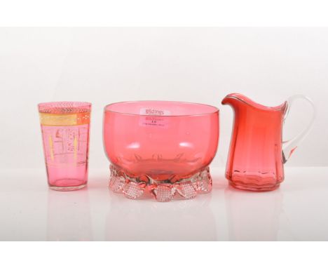 Cranberry glass basin, diameter 13cm, Cranberry glass jug, beaker and two other items of coloured glass, (5).