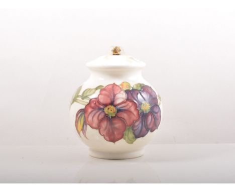 Moorcroft bulbous shaped lamp base, 'Anemone' design on an ivory coloured ground, 19cm with a shade.