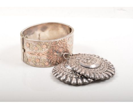 Victorian silver hinged bangle, rose metal inlay, French silver cloak clasp, a silver scent file, a pendant and fob watch.