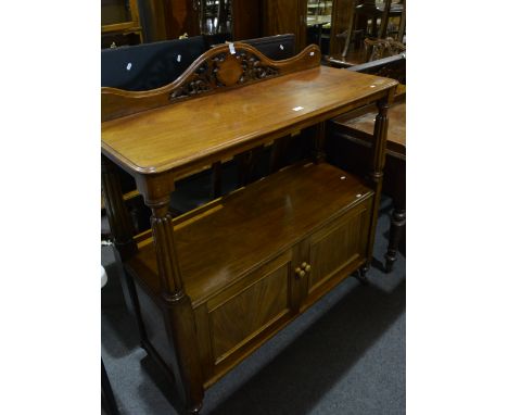 Victorian mahogany buffet, shaped back with fretted cartouche, shelf top, cupboards to the under tier, width 122cm.