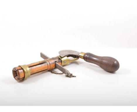 Treen:  Sycamore cylindrical box containing watch makers tools, 8cm, brass headed hammer, paper roller, brass spanner and a c