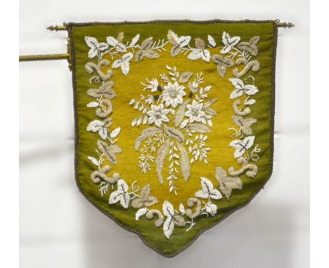 A Victorian bead and woolwork banner fire screen, 47cm x 41cm on a gilt metal bracket, hinged and with an elbow joint.