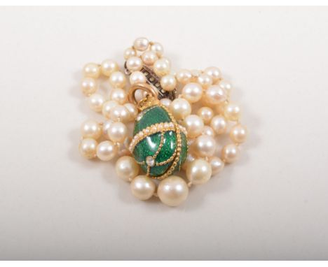 Single stand graduated cultured pearl necklace, with a marcasite clasp and an ornamental egg pendant.