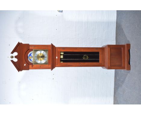 Reproduction hard wood longcase clock, arched brass dial, with a moon phase lunette, German triple chain movement, striking o