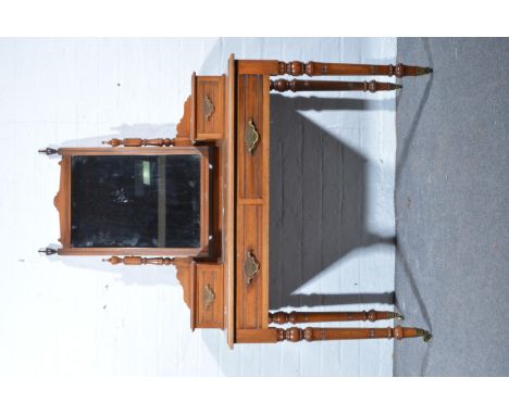 Edwardian mahogany dressing table, rectangular mirror back, with two raised trinket drawers, two frieze drawers, turned and r