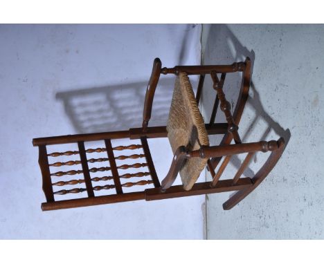 Lancashire bobbin back rocking chair, with sea grass seat.