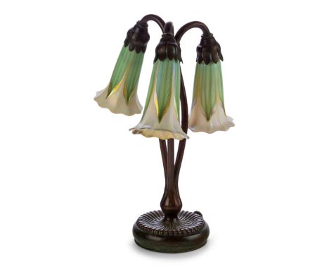 Tiffany StudiosThree branch 'Lily' table lamp with Quezal shades, circa 1910Bronze, glassUnderside impressed 'TIFFANY STUDIOS