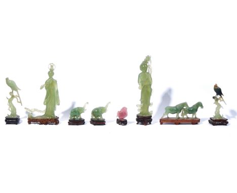 A GROUP OF EIGHT CHINESE HARDSTONE FIGURES20th centuryComprising; two figures of Guanyin; a pair of elephants; two birds in b