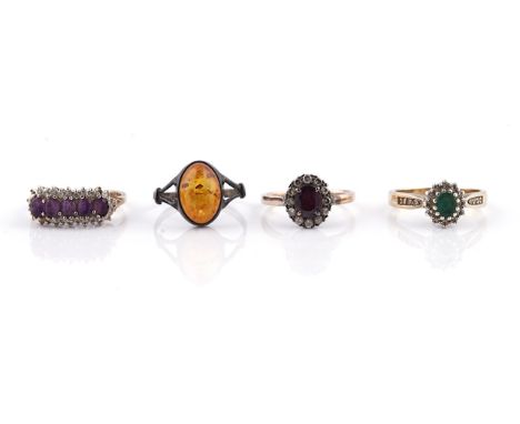 A 9CT GOLD, AMETHYST AND DIAMOND RING AND THREE FURTHER RINGS (4)The amethyst and diamond ring claw set with a row of five ov