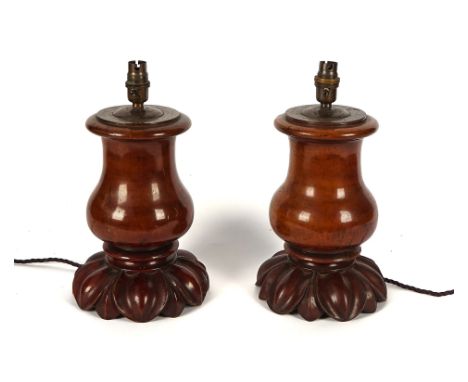 WNAI - A PAIR OF MAHOGANY BALUSTER TABLE LAMPS (2)19th Century and later, adapted, each with carved lotus leaf base, 33cm hig