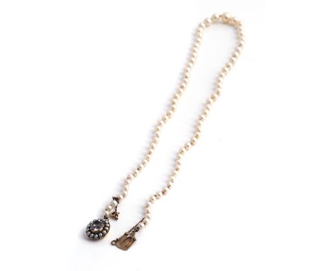 A GRADUATED SINGLE ROW CULTURED PEARL NECKLACEThe cultured pearls measuring from 7.09mm to 3.62mm, fitted to a gold, foil bac
