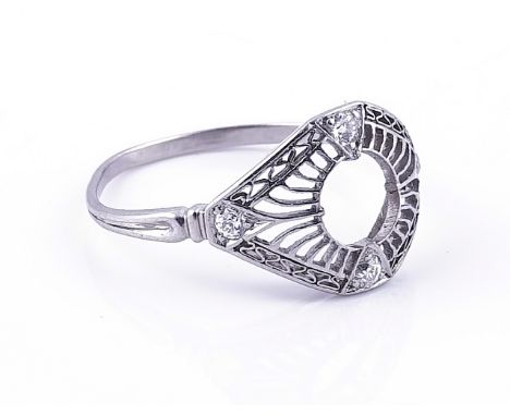 A PLATINUM AND DIAMOND RING MOUNTThe central gemstone lacking, otherwise with pierced decoration mounted with four small cush