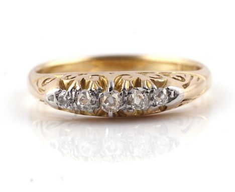 A GOLD AND DIAMOND FIVE STONE RINGMounted with a row of graduated diamonds, detailed 18 CT, ring size L and a half, gross wei