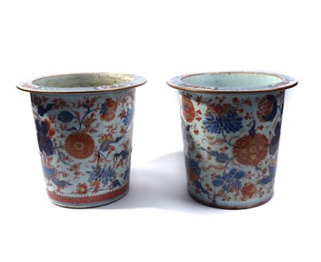 A PAIR OF CHINESE IMARI JARDINIERES (2)Qianlong (1736-95)Slighty tapered cylindrical form, painted in underglaze-blue, iron-r