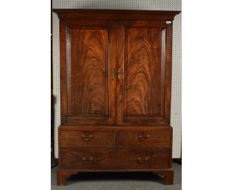 A GEORGE III MAHOGANY LINEN PRESSWith a pair of doors over two short and one long drawer 132cm wide; 55cm deep (front to back
