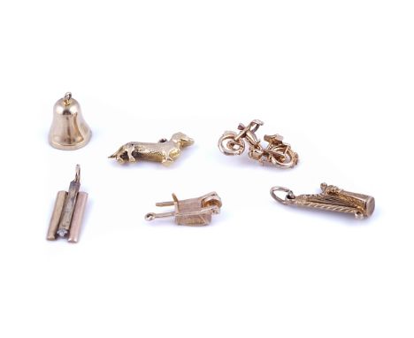 SIX 9CT GOLD PENDANTS AND CHARMS (6)Comprising; a motorcycle, a harp, a bell, a dog, a three colour gold and diamond pendant 