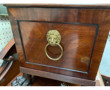 A REGENCY MAHOGANY SARCOPHAGUS CELLARETTEOn later paw feet, 60cm wide; 48cm high45.5cm deep overall.&nbsp;Condition report:&n