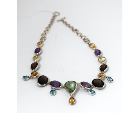 A SILVER AND VARICOLOURED GEMSTONE NECKLACECollet set with oval and pear shaped gemstones, including amethyst, blue topaz and