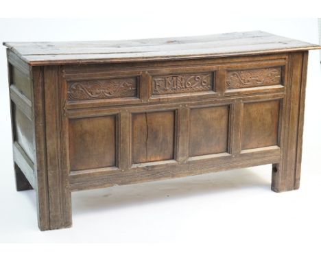 A LARGE 17TH CENTURY OAK COFFERWith four panel front on stile feet, 150cm wide; 60cm deep; 79cm highCondition report:&nbsp;Ol