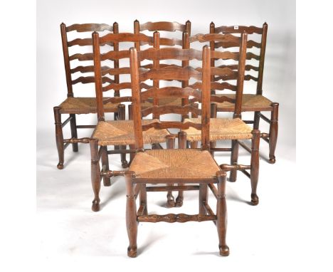 A MATCHED SET OF SIX GEORGE III ASH LADDER BACK DINING CHAIRS (6)With rushed seats on turned supports