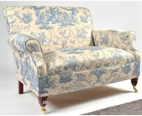 A MODERN SMALL TWO SEAT SOFACovered in Toile de Jouy fabric, on turned supports, 125cm wide; 87cm highCondition report:&nbsp;