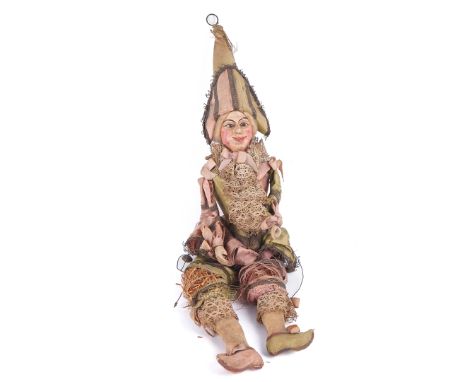 A FRENCH "PUNCH" PUPPET19th CenturyPainted face and carved wooden hands, green and pink silk costume, straw-filled, approx 45