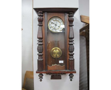 XIX Century Walnut Cased Vienna Wall Clock, with a stepped pediment, circular enamel dial, Roman numerals, base with turned f