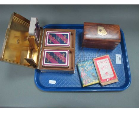 A Circa 1930's Heavy Brass Art Deco Design Playing Card Box, 16cm wide; another wooden example plus packs of cards:- One Tray