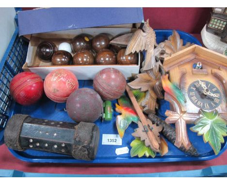 Table Bowls, cricket balls, octagonal dice, cuckoo clock:- One Tray.