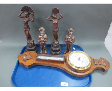 An Edwardian Oak Barometer/Thermometer, a pair of metal Art Deco lady figurines, two 1930's Knight poker stands:- One Tray