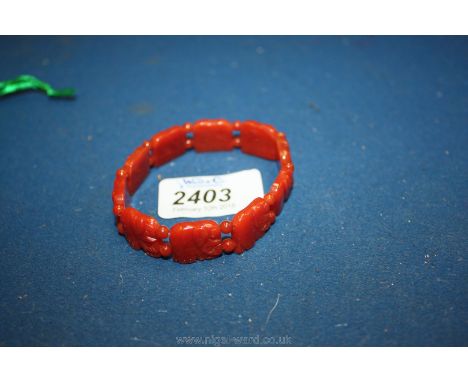 A red Jade Bracelet with elephant panels