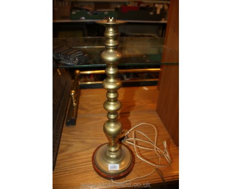 A Brass Lamp on a wooden base, 19 1/2'' tall.