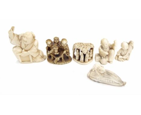 Small collection of Japanese antique ivory netsuke and okimono; including miniature carved figural group under a roofed shelt