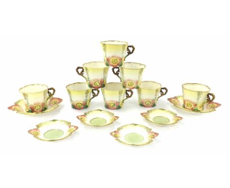 Attractive Continental porcelain part tea service, decorated in low relief with flowers in pastel shades, comprising eight te