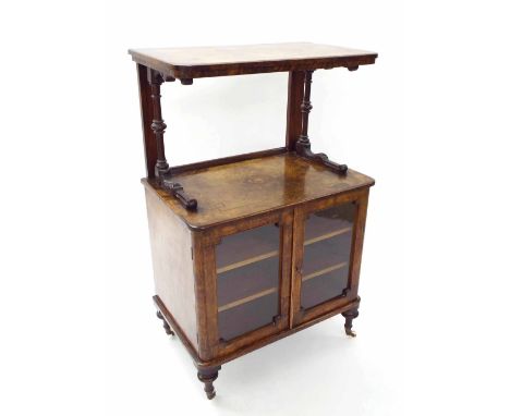 Victorian figured walnut inlaid music cabinet, the rectangular open shelf upon turned supports over double glazed doors enclo