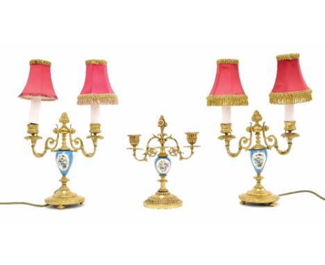 Pair of French porcelain and gilt metal twin branch table lamps converted to electricity, each with twin scroll branches and 