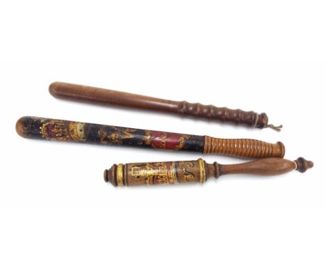 Police truncheons to include a Victorian polychrome and gilded wooden truncheon, with the Royal Crown cypher above 'Constable